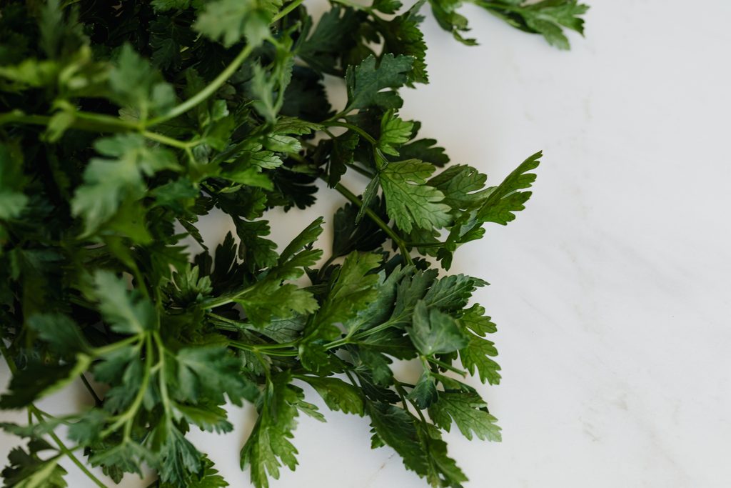 fresh parsley on a marble countertop